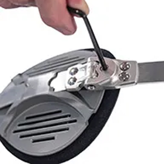 An individual uses a screwdriver to open a metal object associated with Rebound Hip™ in New York