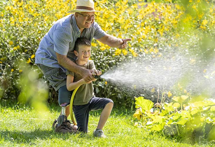 A grandparent playing with his grandson