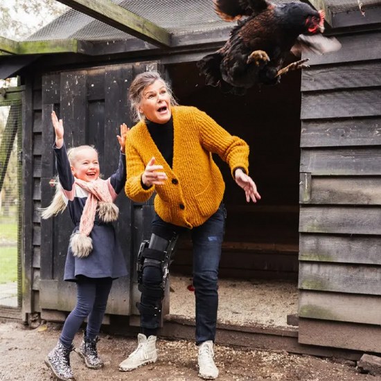 An old lady playing with her daughter while wearing a C-Brace in New York and New Jersey